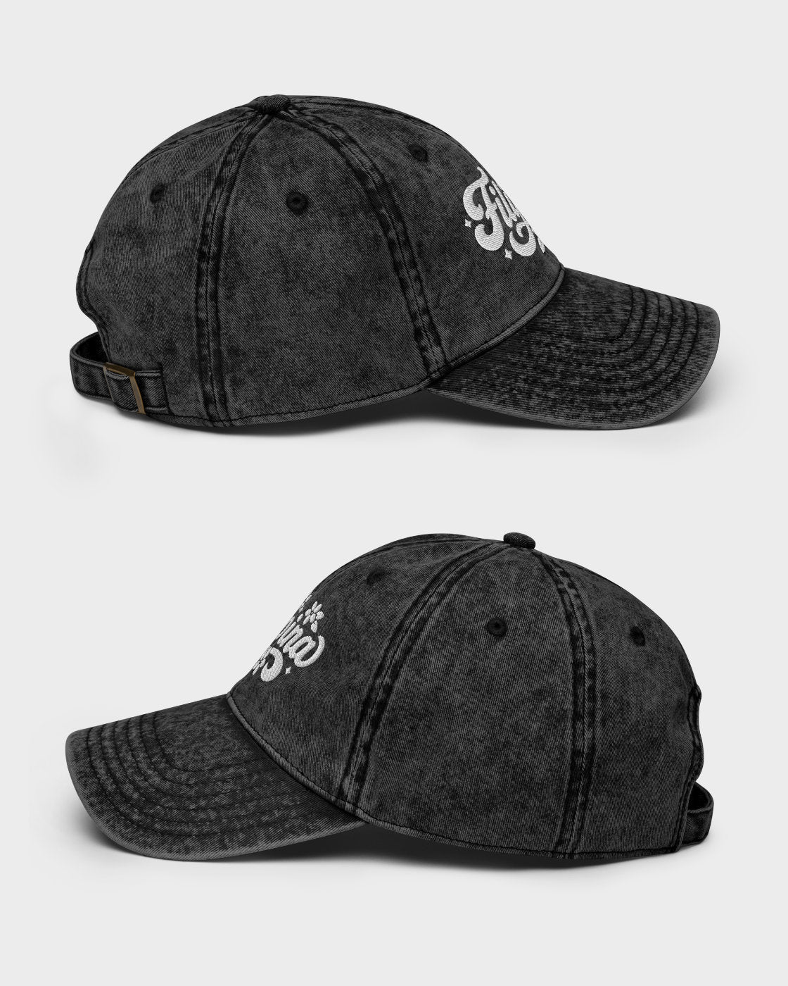 Two views of a washed black baseball cap with a white embroidered logo on the side, displayed against a light gray background.