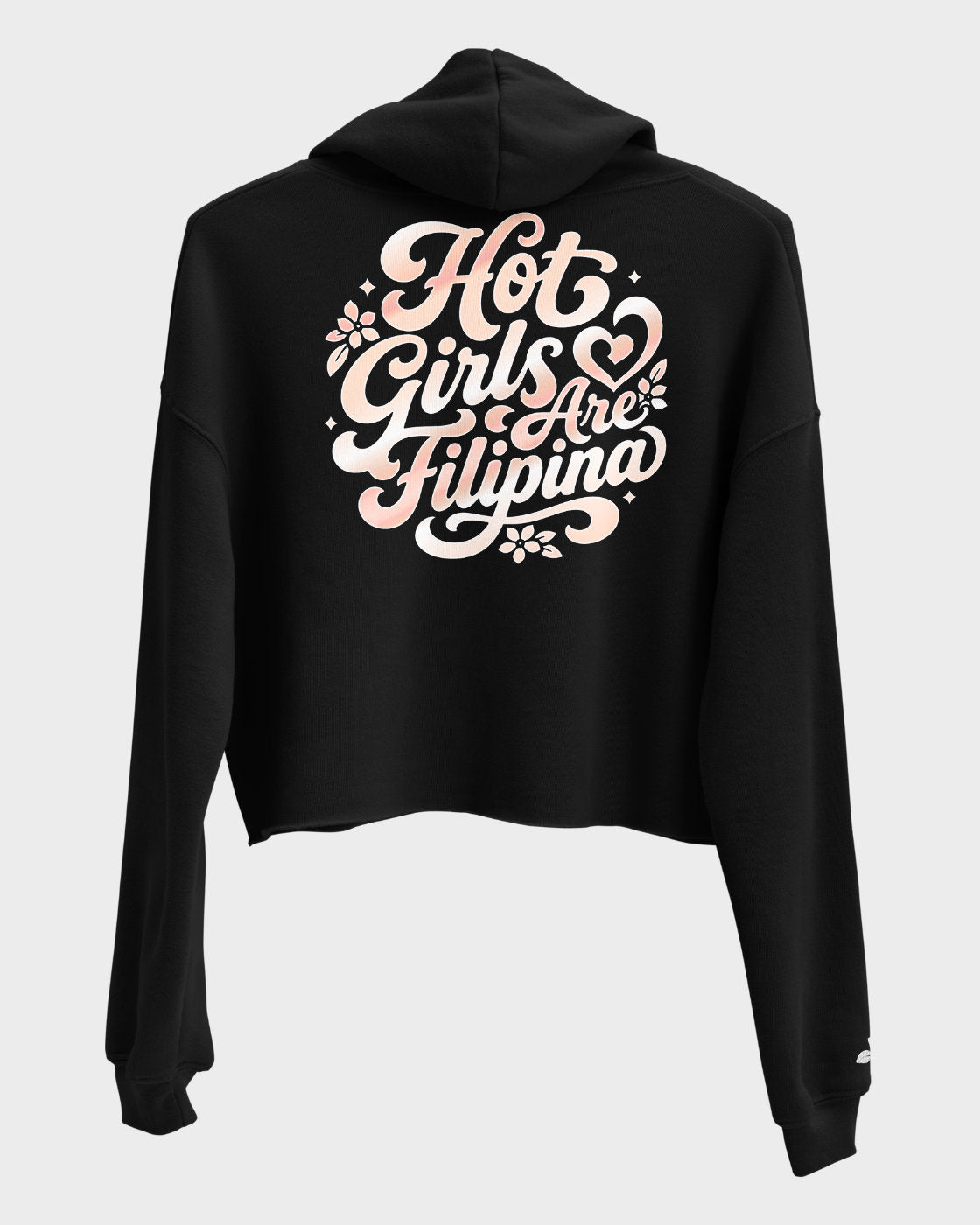 A black cropped hoodie shown from the back, featuring a large rose gold script graphic that reads 'Hot Girls Are Filipina' with floral and heart details, set against a light gray background.