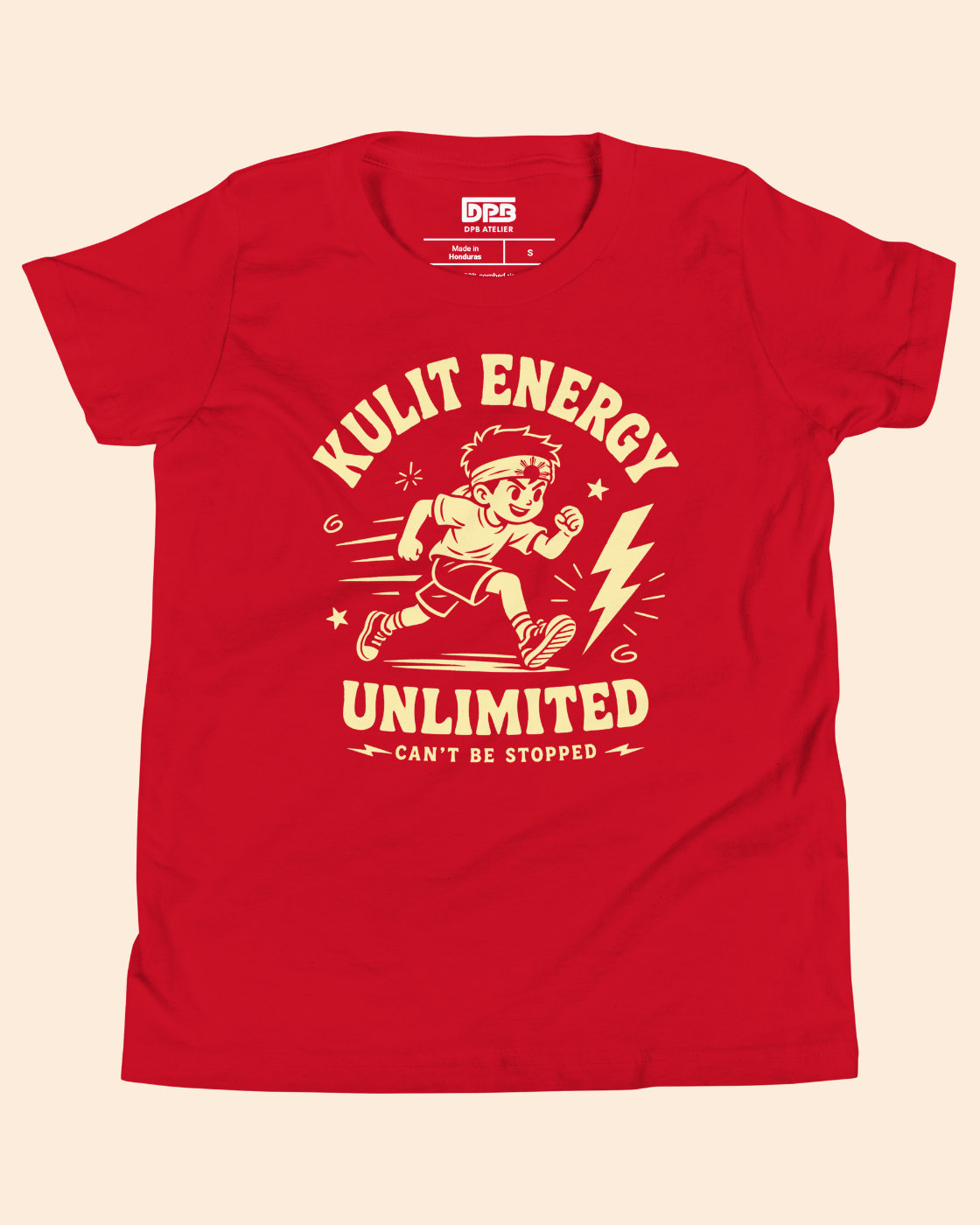 A red short-sleeve t-shirt with a vintage-style cream graphic of a running athlete and the text 'KULIT ENERGY UNLIMITED CAN'T BE STOPPED'. The brand name 'IPBS' is visible on the inner neck label.