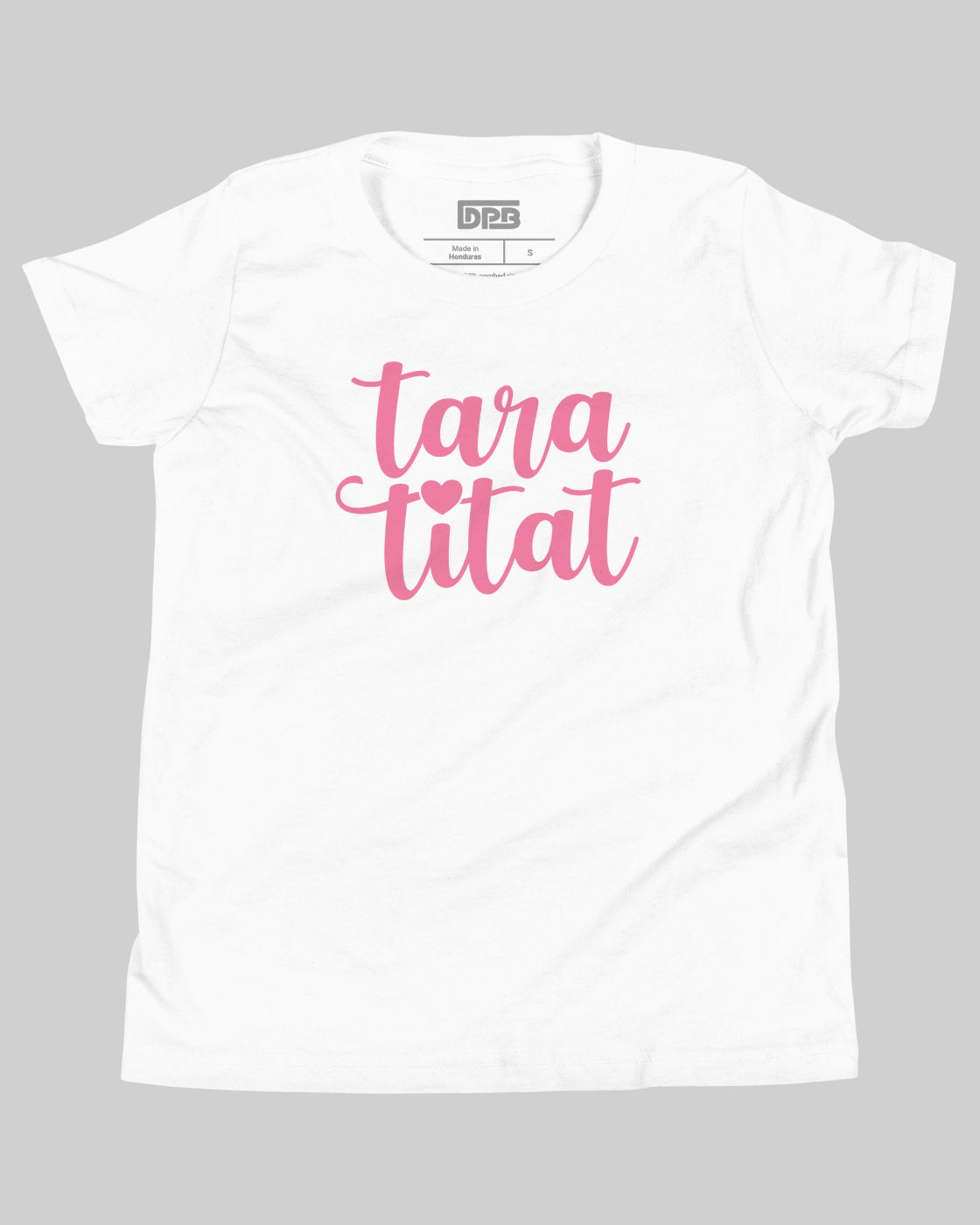 A white short-sleeve t-shirt with the phrase 'taratitat' printed in pink cursive script across the chest, featuring a small pink heart between the words. The shirt is displayed flat against a solid gray background.